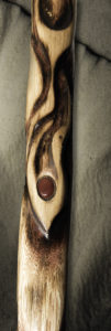 A two-foot tall, three-inch diameter section of an oak staff, burned with artistic representations of flames. The center of the staff image shows an inset red Mookaite Jasper stone.